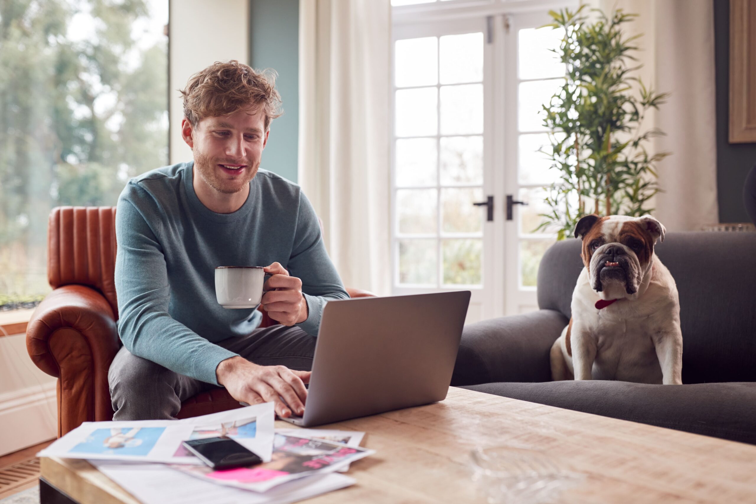 man-working-from-home-dog-marketing-blog-post-content-writer