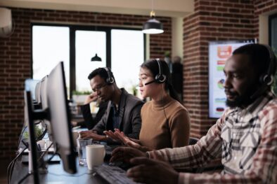 Operator working at call center with multiethnic group of people